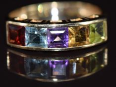 A 9ct gold ring set with garnet, topaz, amethyst, citrine and peridot, 1.9g, size N