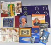 A quantity of coin presentation packs, etc some empty, silk flag cigarette cards etc