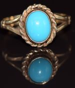 A 9ct gold ring set with a turquoise cabochon, 2.2g, size J