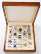 Thirty four silver rings including cubic zirconia, pressed amber, etc