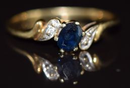 A 9ct gold ring set with a sapphire and diamonds, 1.3g, size I