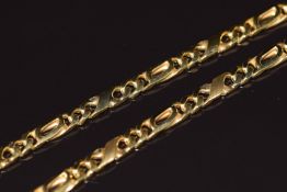 A 9ct gold necklace made up of fancy curb links, 28.2g