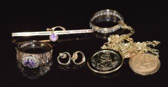 A 9ct gold 1970's ring set with an amethyst, 9ct gold eternity ring, a 9ct gold brooch set with an