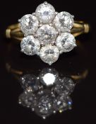 An 18ct gold ring set with seven diamonds, each approximately 0.3ct, in a cluster, 4.6g, size O