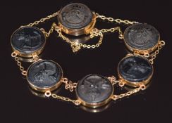 A 9ct gold bracelet set with six Royal King's Rifle Corps buttons (c1910), 16.7g 19cm