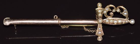 A 9ct gold brooch in the form of a sword set with seed pearls, in original box, 5.3g