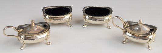 Set of four Elizabeth II hallmarked silver salts and mustards with blue glass liners, Birmingham