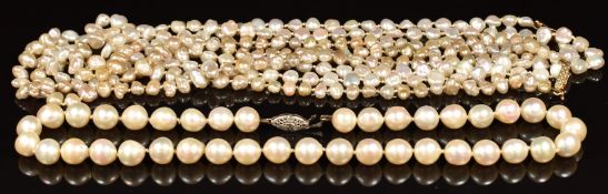 Three pearl necklaces, one with 14k white gold clasp the others with 18k gold clasps