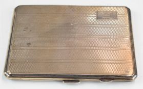 George VI hallmarked silver cigarette case with Art Deco style engine turned decoration and gilt