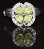 A 9ct white gold ring set with peridot and diamonds, 4g, size N