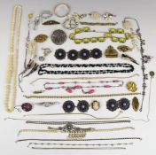 A collection of costume jewellery including rolled gold bangle, French jet necklace, enamel belt