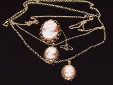 Two 9ct gold pendants set with a cameo to each, on 9ct gold chains, and a 9ct gold brooch set with a