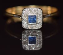 A c1920 18ct gold ring set with a sapphire surrounded by diamonds, 2.2g, size O