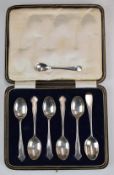 Seven hallmarked silver spoons including a set of five Arts and Crafts or Celtic inspired