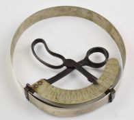 Vintage shop hat measuring tool with scissor type mechanism