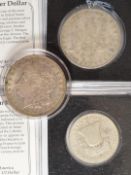 Three American coins comprising 1880 and 1921 Morgan Dollars and a 1948 Liberty half Dollar