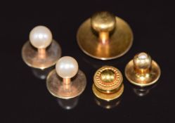 A 15ct gold stud (1.8g), two 9ct gold Ciro studs set with faux pearls (2.1g), a 9ct gold stud set