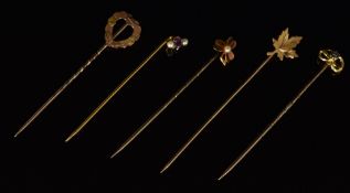 Four 9ct gold stick pins, including one in the form of a heart, Chester 1901, one set with a