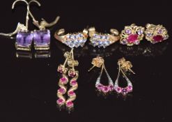 Five pairs of 9ct gold earrings set with amethysts, rubies, and tanzanites, 12.3g