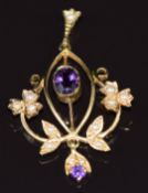 A 9ct gold pendant set with two amethysts and seed pearls, 3.3g