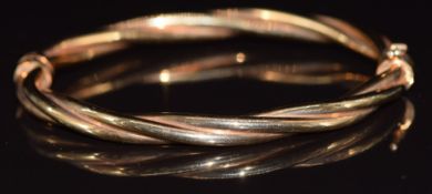 A 9ct gold bangle in a twisted design, 12g