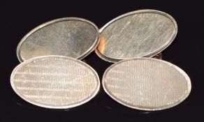 A pair of 9ct gold cufflinks with engine turned decoration, 5.3g