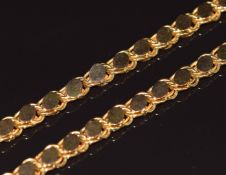 An 18ct gold necklace made up of knotted links with oval panels, 53.7g