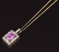 A 9ct gold pendant set with an oval pink sapphire and diamonds (1.6g) on 18ct gold chain (0.8g)