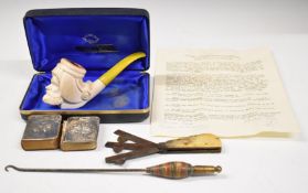Cased carved block Meerschaum pipe together with two hallmarked silver mounted books, fleams and a