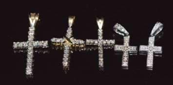 Five 9ct gold pendants in the form of crosses set with diamonds, 4.6g