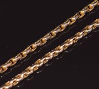 A c1900 9ct rose gold necklace made up of faceted oval links, 29.7g
