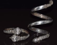 Two Victorian silver Etruscan Revival bangles, one in the form of a snake