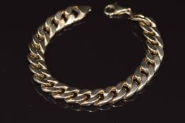A 9k gold curb link bracelet, 17g