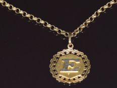 A 9ct gold necklace made up of circular links (14.8g) with 18ct gold letter E pendant (3.2g)