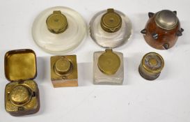 Seven various inkwells comprising three with Post Office or similar S O and crown to lids, three