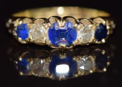Victorian 18ct gold ring set with a sapphire, paste and two diamonds, Birmingham 1885, 3.6g, size M