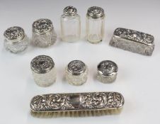 Nine various hallmarked silver lidded and mounted items comprising brush and various glass pots