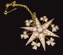 Edwardian 9ct gold pendant/ brooch in the form of a star and shamrocks, set with seed pearls, 5.3g