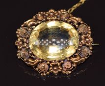 Late Victorian brooch set with an oval cut citrine with a floral border, 7.5g 2.9x2.6cm
