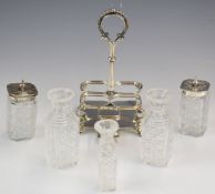 Victorian hallmarked silver cruet set on stand, with five cut glass bottles, raised on hoof feet