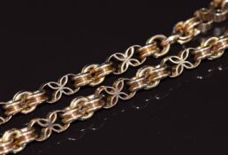 Victorian 9ct gold fob chain made up of circular and pierced floral links, 23g, 38.5cm long
