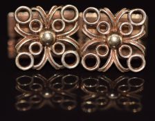 A pair of 9ct gold cufflinks with pierced and hammered decoration, 7.3g