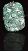 A 9ct white gold ring set with a carved jadeite plaque, 2.9g, size M
