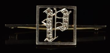 An 18ct gold brooch in the form of a 'P' set with rose cut diamonds, with platinum finish, 2.8g