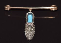 An early Victorian brooch / charm in the form of a shoe set with rose cut diamonds and guilloché