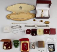 A collection of jewellery including silver necklace, silver locket, silver and marcasite ring,