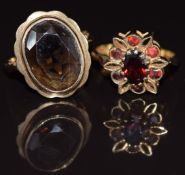 Two 9ct gold rings, one set with garnets and one a smoky quartz, 6.9g, size K