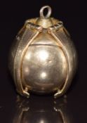 A 9ct gold Masonic sphere charm/ pendant opening to reveal Masonic symbols