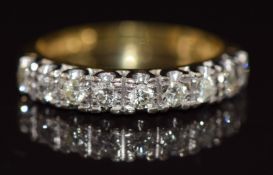 An 18ct gold ring set with nine round cut diamonds, 3.4g, size M