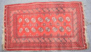 Turkoman rug with sixteen guls on a wine ground, 172 x 103cm